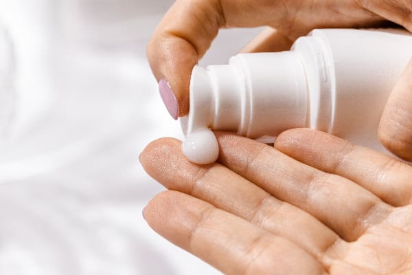 lotion pouring in a hand
